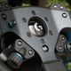 Close up on spokes and controls of Logitech G Pro steering wheel.
